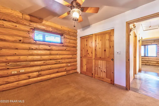 a view of an empty room with a windows