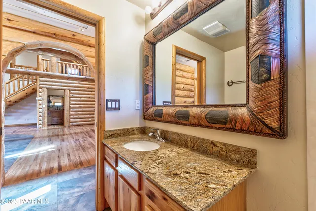 a view of a backyard with wooden floor and a tub