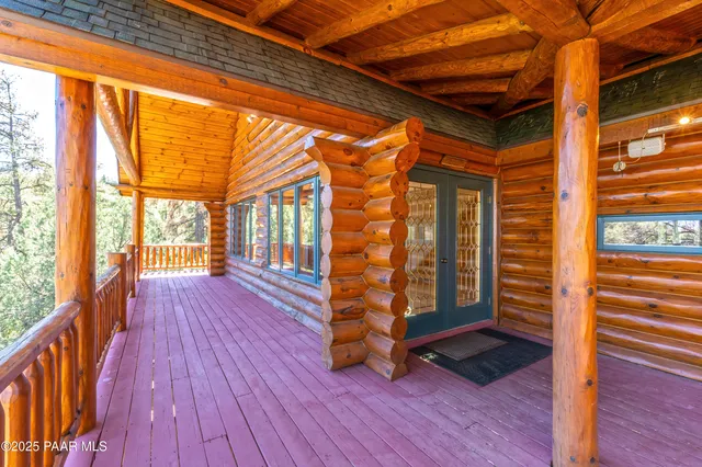 a view of a lush green field with lots of bushes