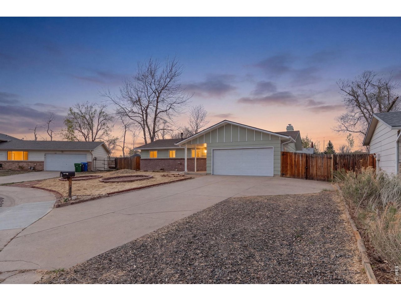 a view of a house with a yard and garage