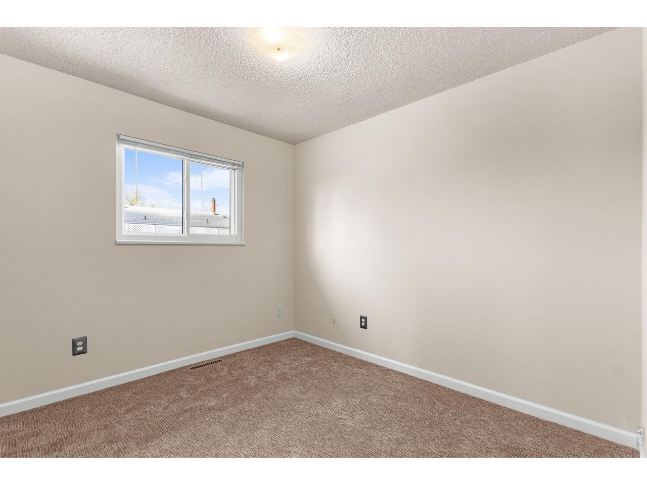 2912 Radcliff Circle Fort Collins, CO 80521 - Photo 19 of 46 an empty room with windows