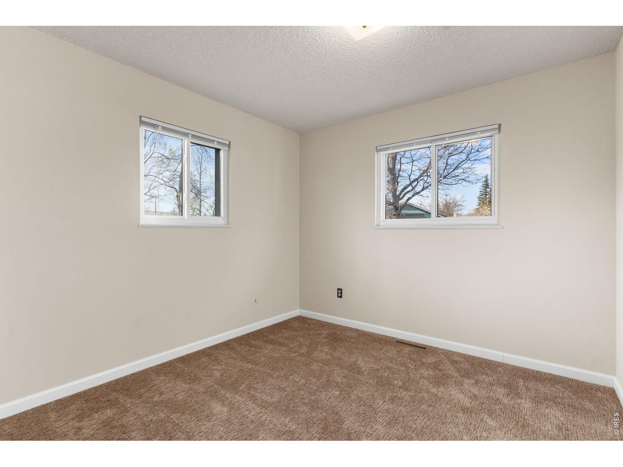2912 Radcliff Circle Fort Collins, CO 80521 - Photo 24 of 46 an empty room with a painting on the wall