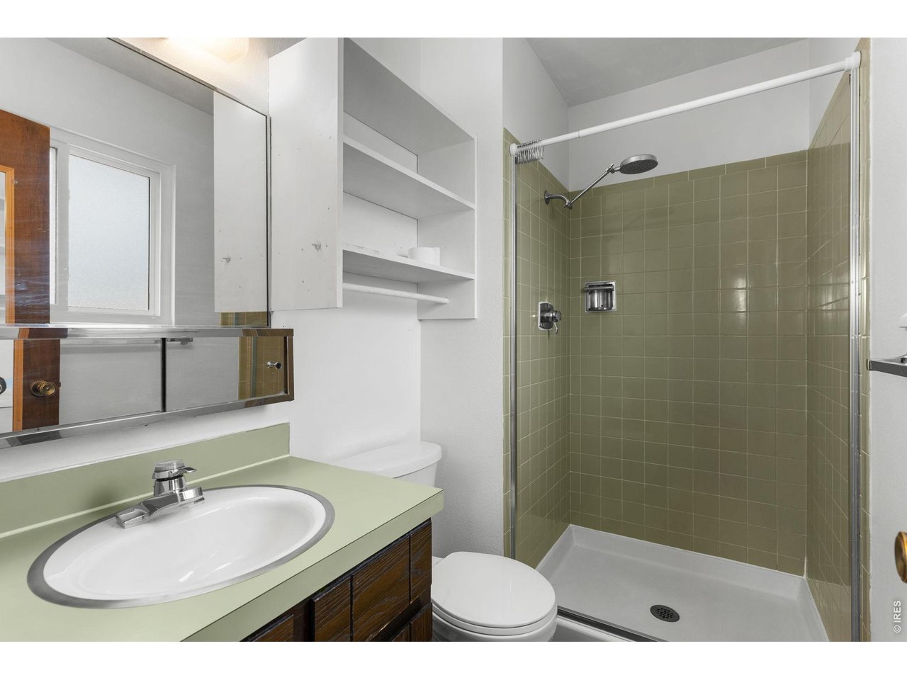 2912 Radcliff Circle Fort Collins, CO 80521 - Photo 26 of 46 a bathroom with a sink toilet a mirror and shower