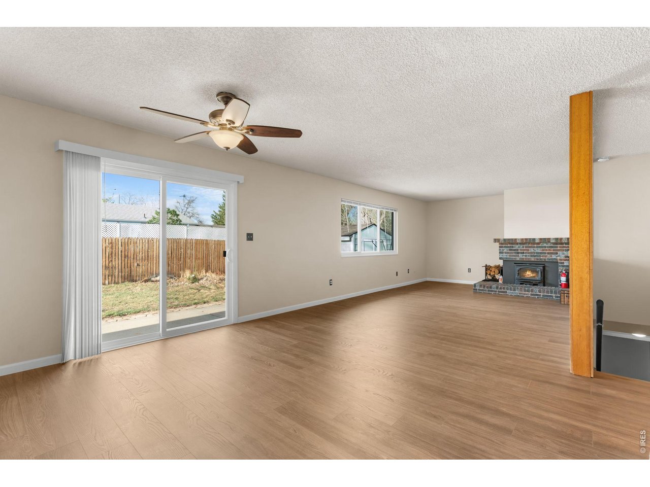 2912 Radcliff Circle Fort Collins, CO 80521 - Photo 7 of 46 a view of a livingroom with wooden floor and a ceiling fan