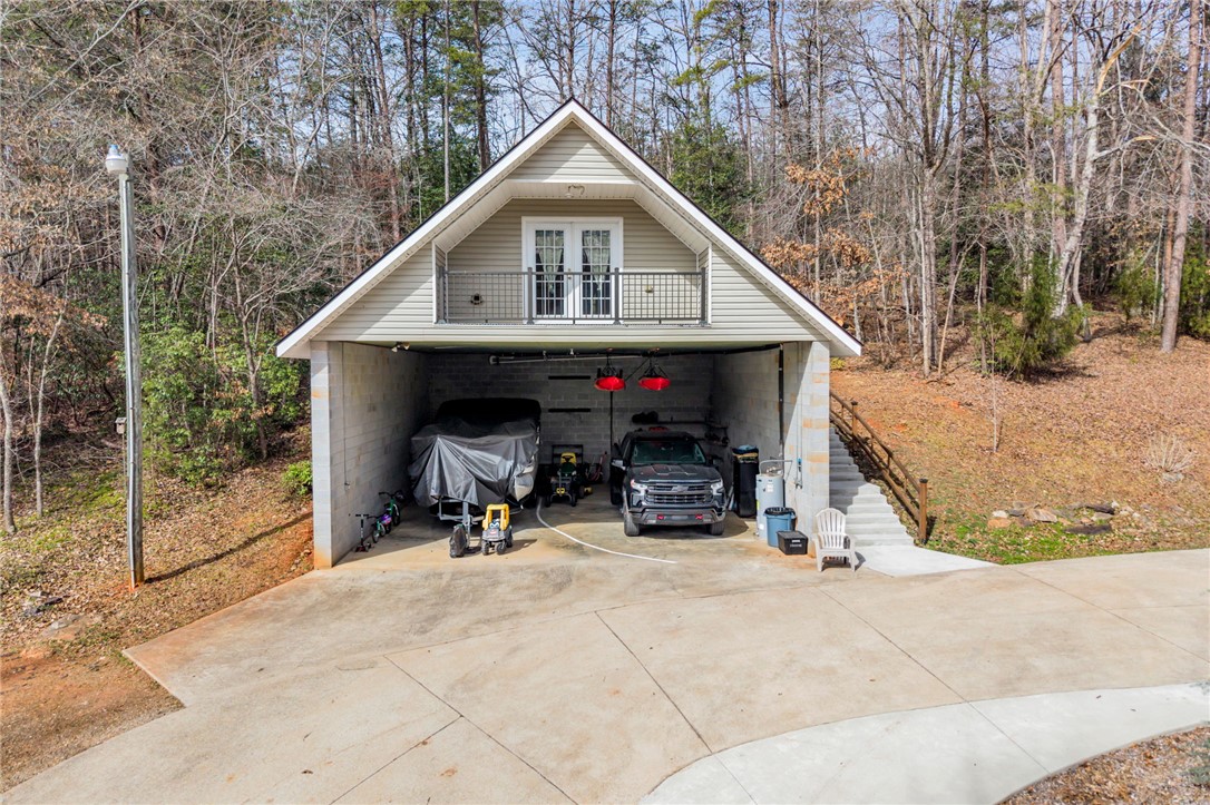 130 Greenbrier Road Salem, SC 29676 - Photo 15 of 48 This versatile structure offers ample garage space with a charming upper-level balcony.