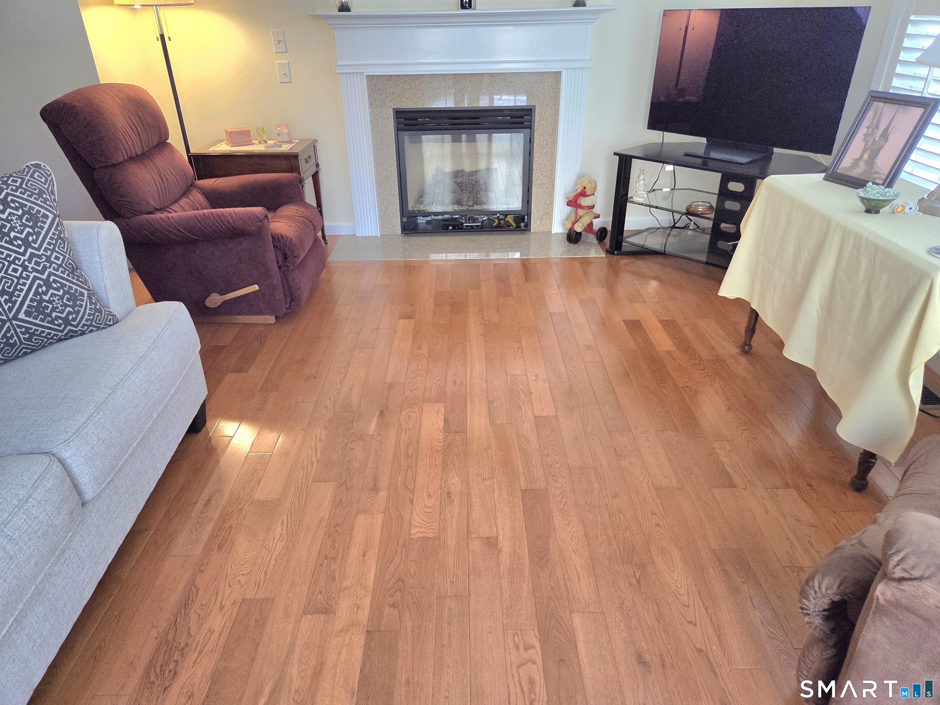 6 Whitman Lane, Unit 6 Vernon, CT 06066 - Photo 11 of 28 a living room with furniture and a fireplace