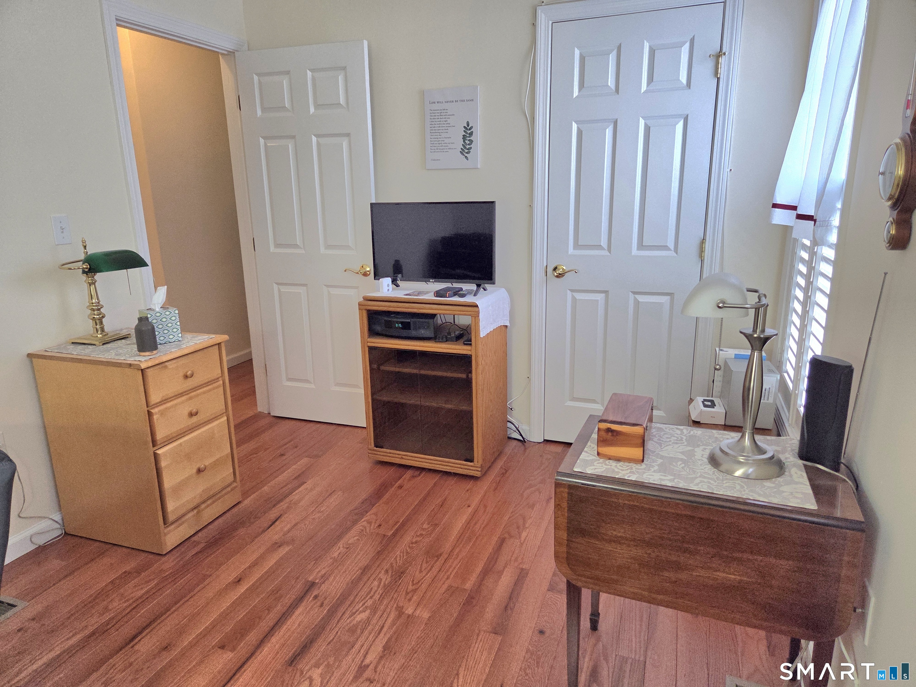 6 Whitman Lane, Unit 6 Vernon, CT 06066 - Photo 12 of 28 a room with furniture a flat screen tv and a fireplace