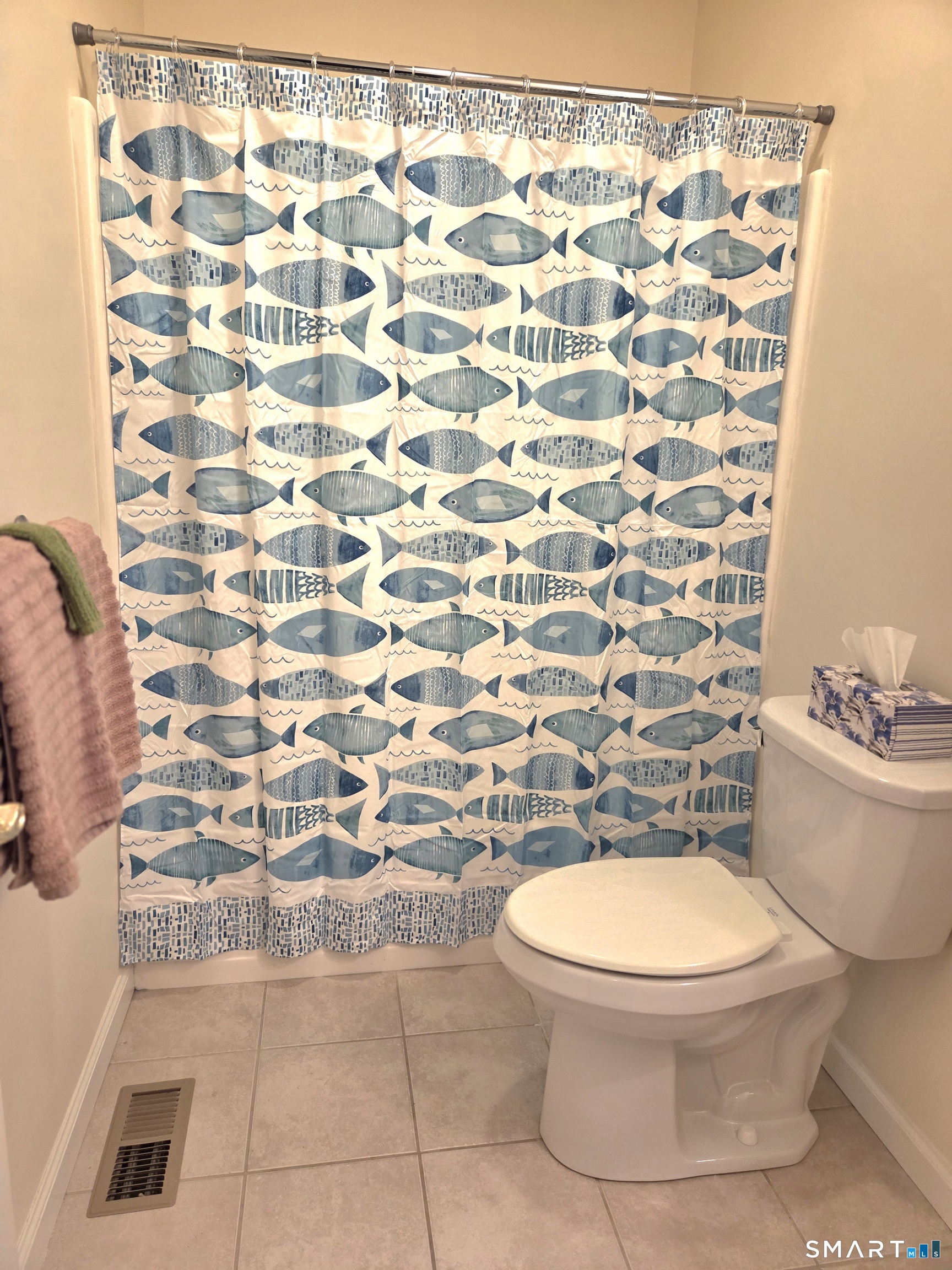 6 Whitman Lane, Unit 6 Vernon, CT 06066 - Photo 16 of 28 a white toilet sitting next to a shower curtain