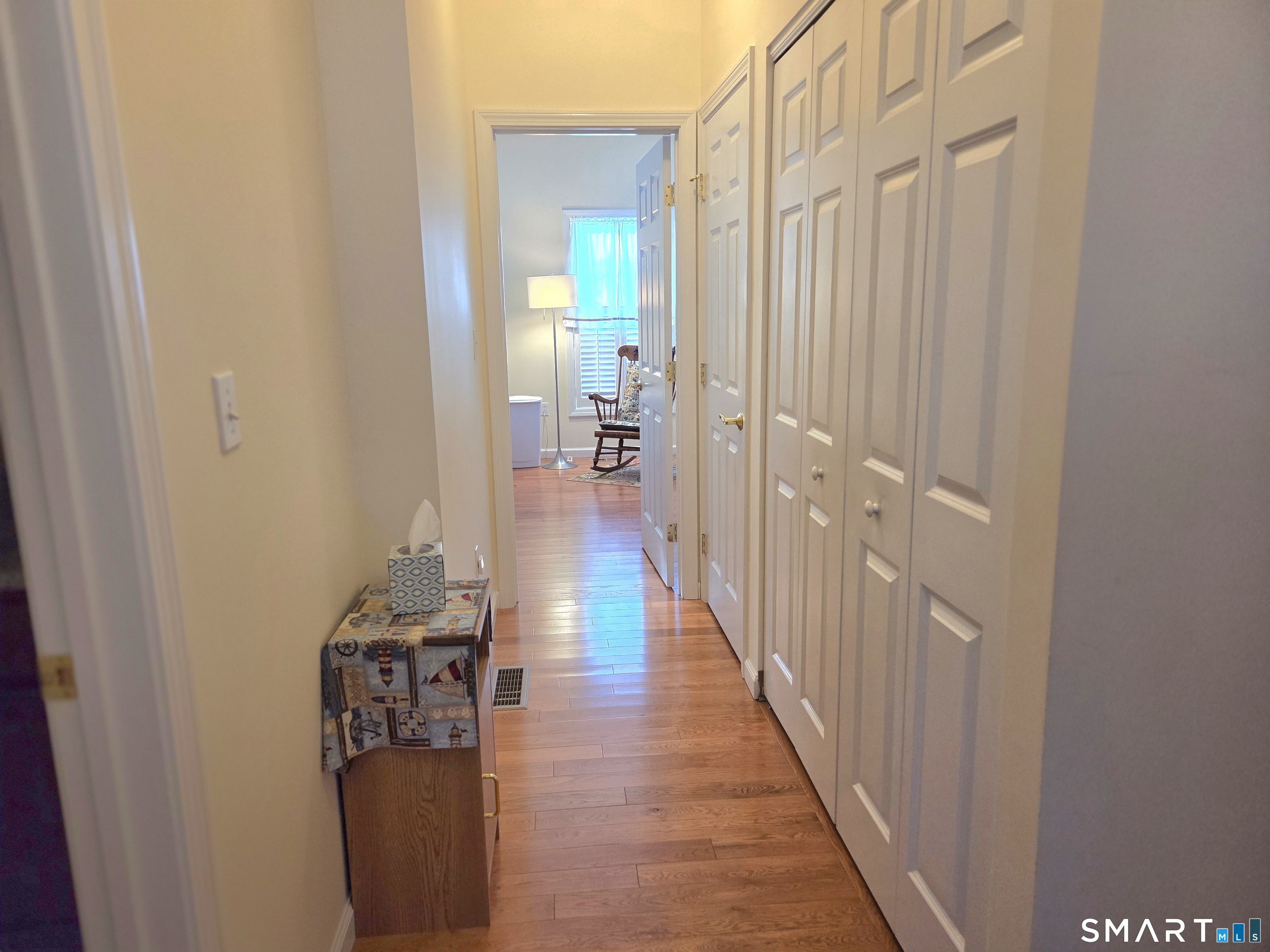 6 Whitman Lane, Unit 6 Vernon, CT 06066 - Photo 17 of 28 a view of a hallway with wooden floor and closet