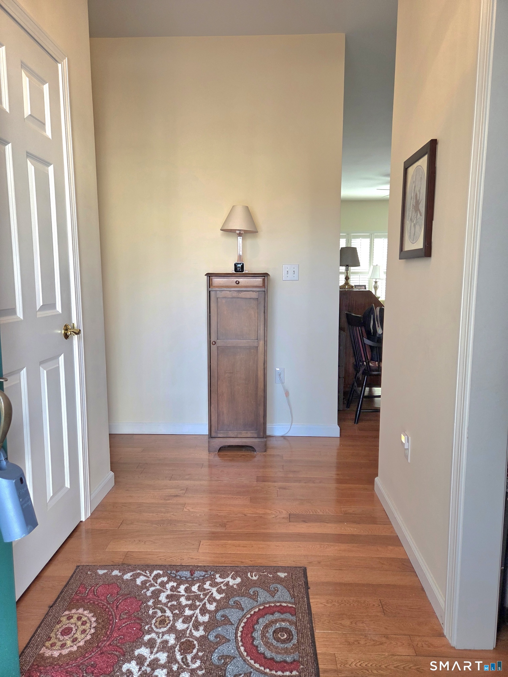 6 Whitman Lane, Unit 6 Vernon, CT 06066 - Photo 3 of 28 a view of a hallway view with wooden floor and staircase