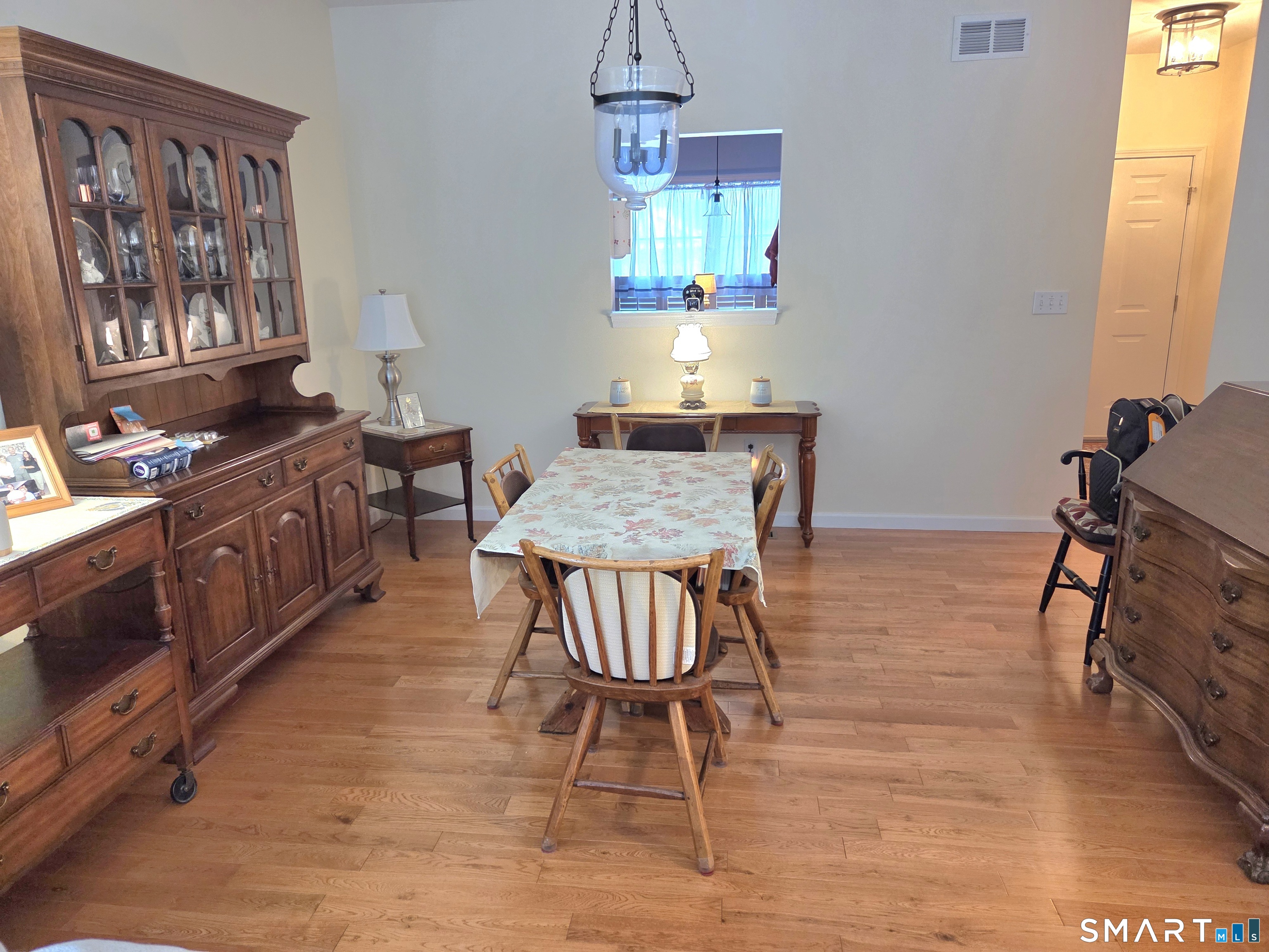 6 Whitman Lane, Unit 6 Vernon, CT 06066 - Photo 9 of 28 a view of a dining room with furniture and window