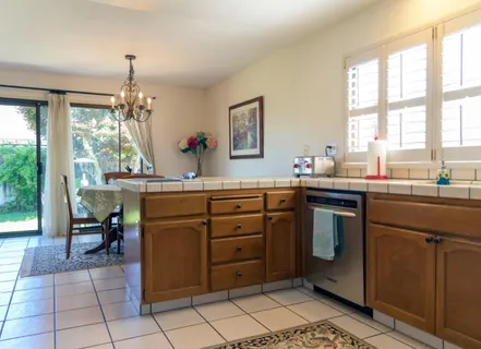a kitchen with a cabinets and white appliances