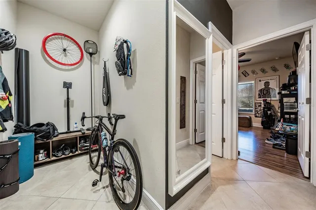 a spacious bathroom with a sink double vanity granite tub shower and a mirror