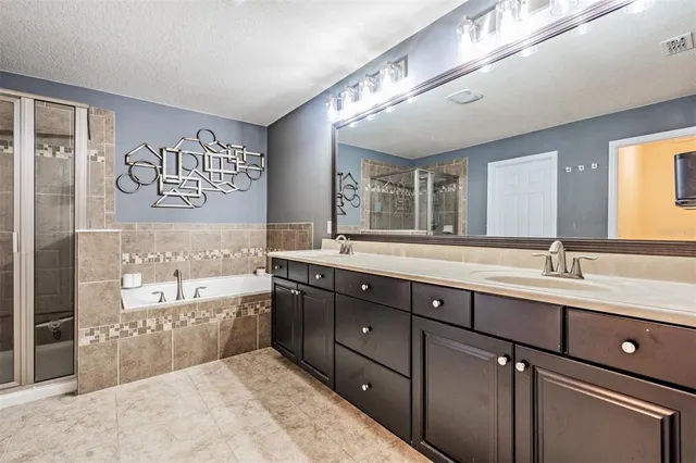 a living room with furniture and a wall painting