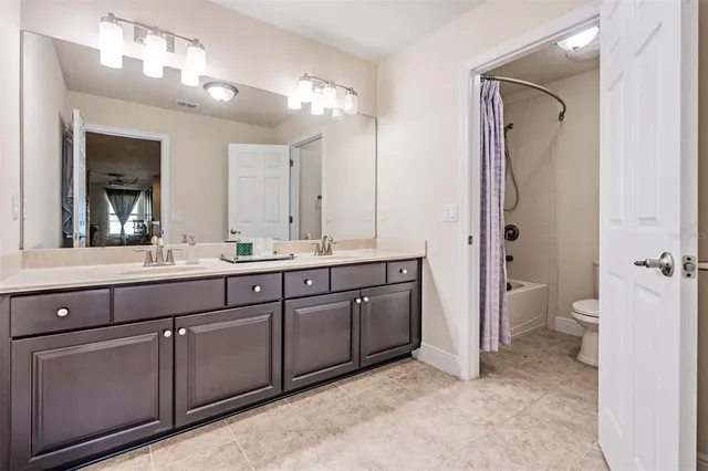 a view of a field with trees in the background