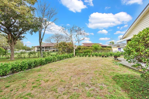 a view of a backyard of the house