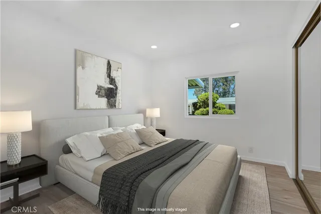 a bathroom with a granite countertop toilet a sink and a bathtub