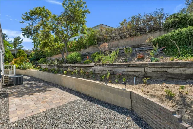 a view of a patio with chair and tables