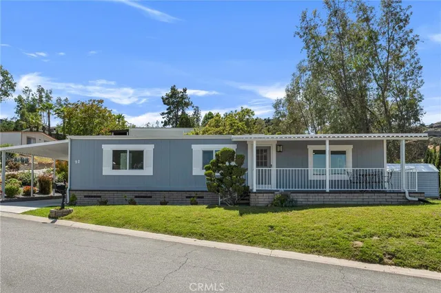 aerial view of a house with swimming pool and a yard