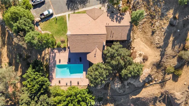 a view of a terrace with yard and mountain view in back