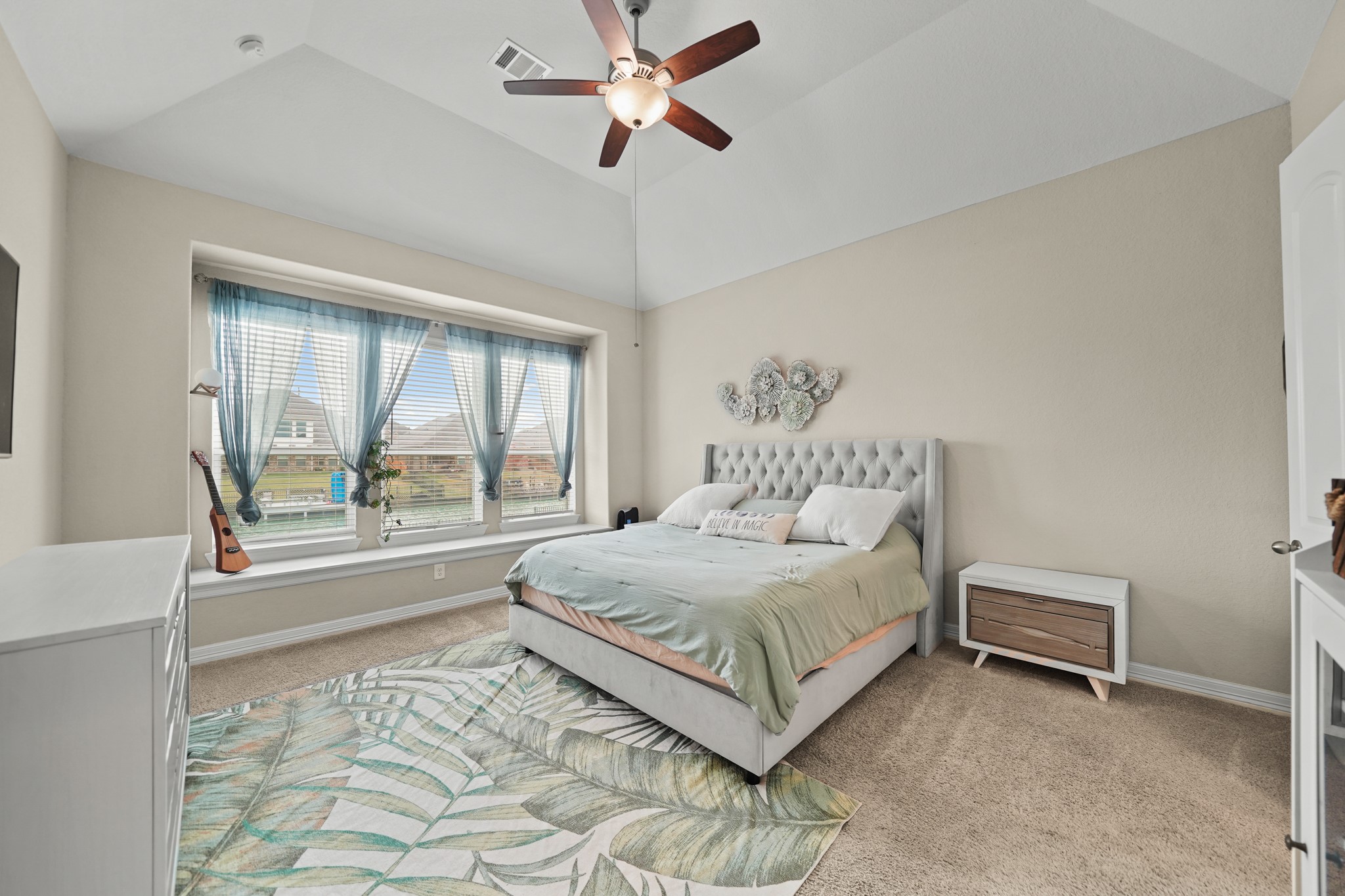 24031 Corinaldo Court Katy, TX 77493 - Photo 11 of 23 a bedroom with a bed and a large window