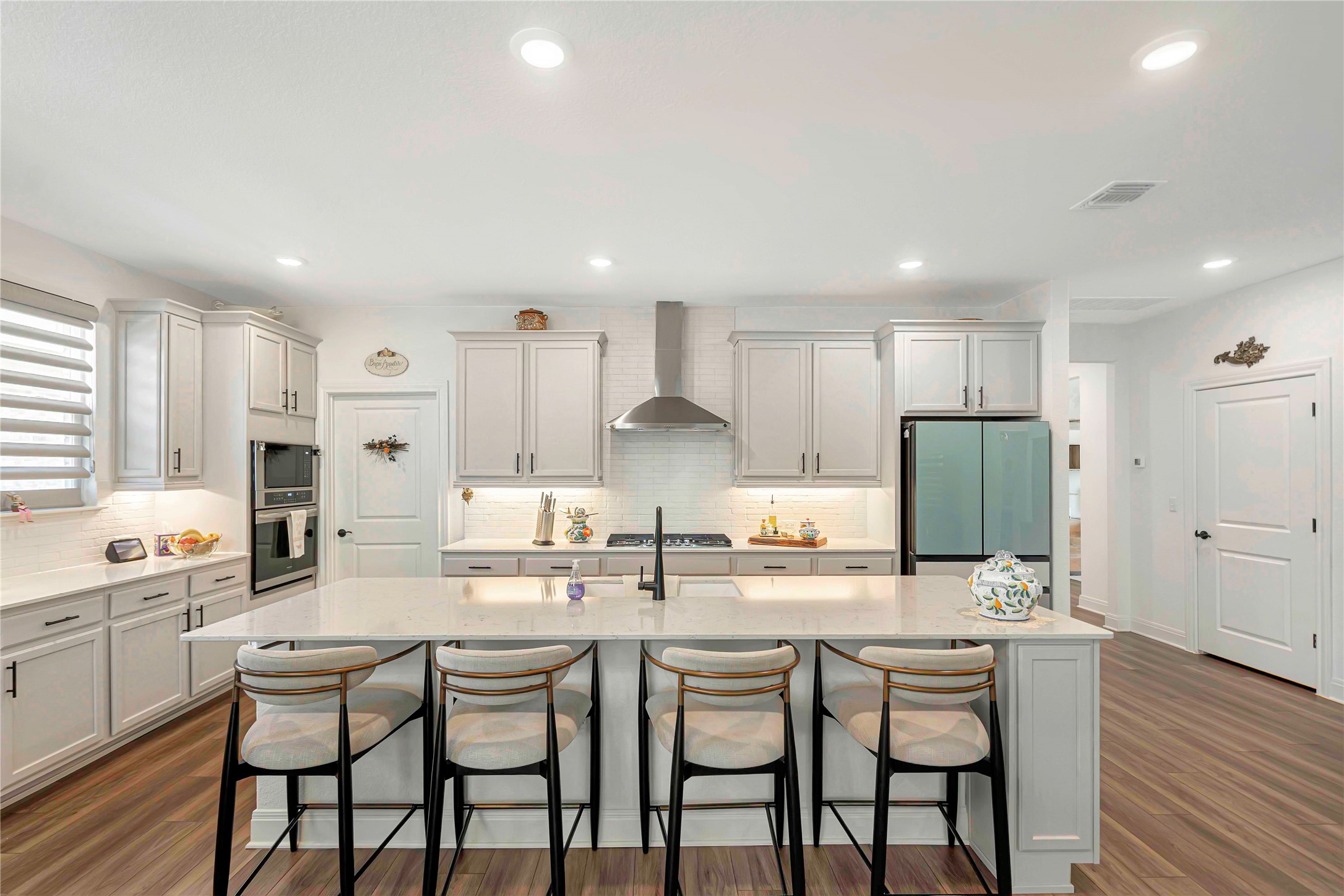 126 Lafayette Street Georgetown, TX 78633 - Photo 1 of 30 a kitchen with center island white cabinets and stainless steel appliances
