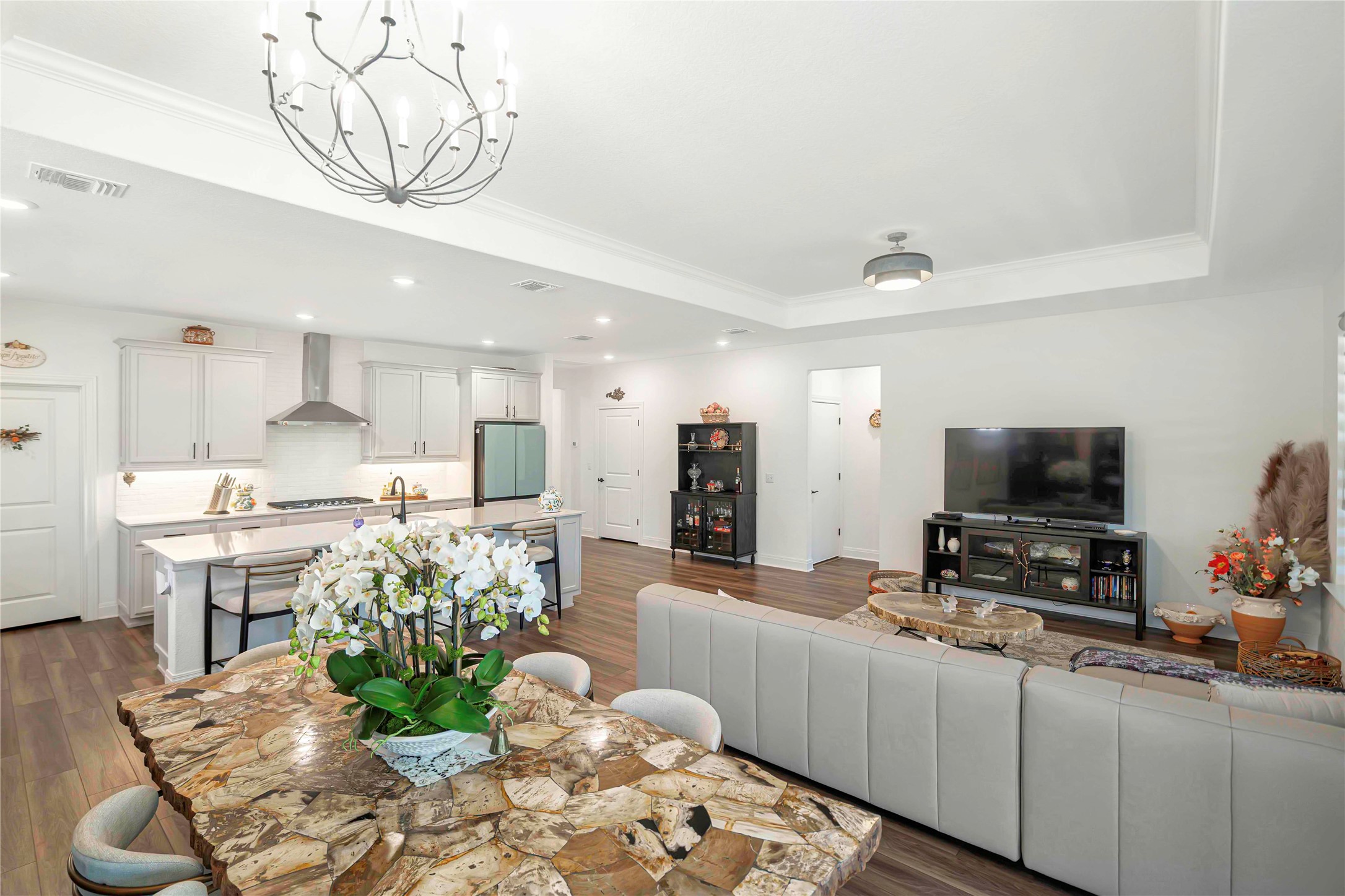 126 Lafayette Street Georgetown, TX 78633 - Photo 13 of 30 a living room with furniture a flat screen tv and a dining table