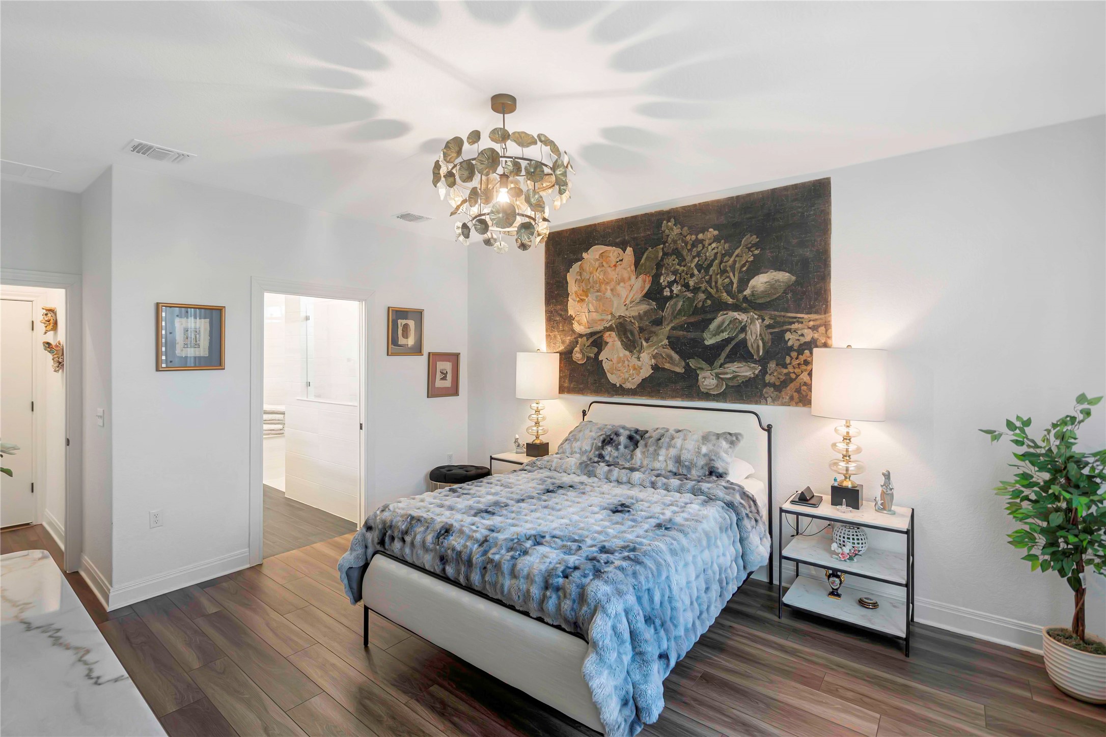 126 Lafayette Street Georgetown, TX 78633 - Photo 14 of 30 a bedroom with a large bed and a chandelier