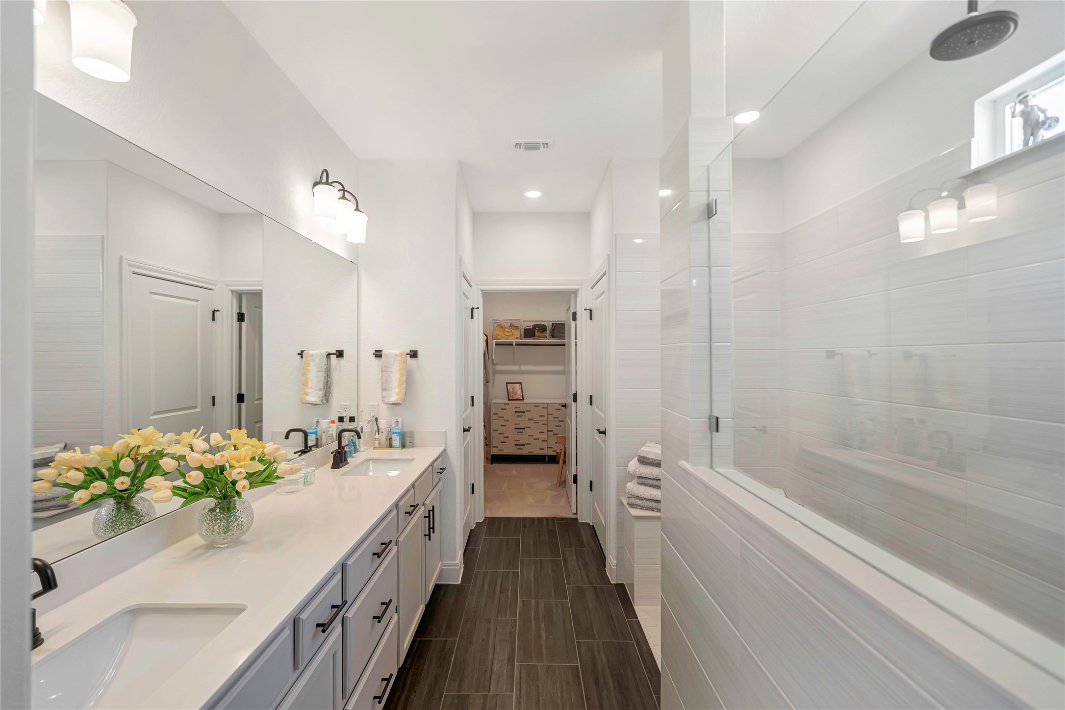 126 Lafayette Street Georgetown, TX 78633 - Photo 16 of 30 a bathroom with a sink a faucet a mirror and a bathtub