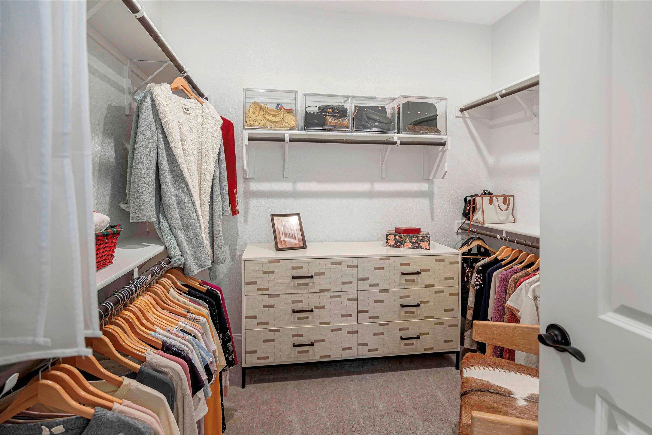 126 Lafayette Street Georgetown, TX 78633 - Photo 18 of 30 a view of walk in closet with clothes and shoes