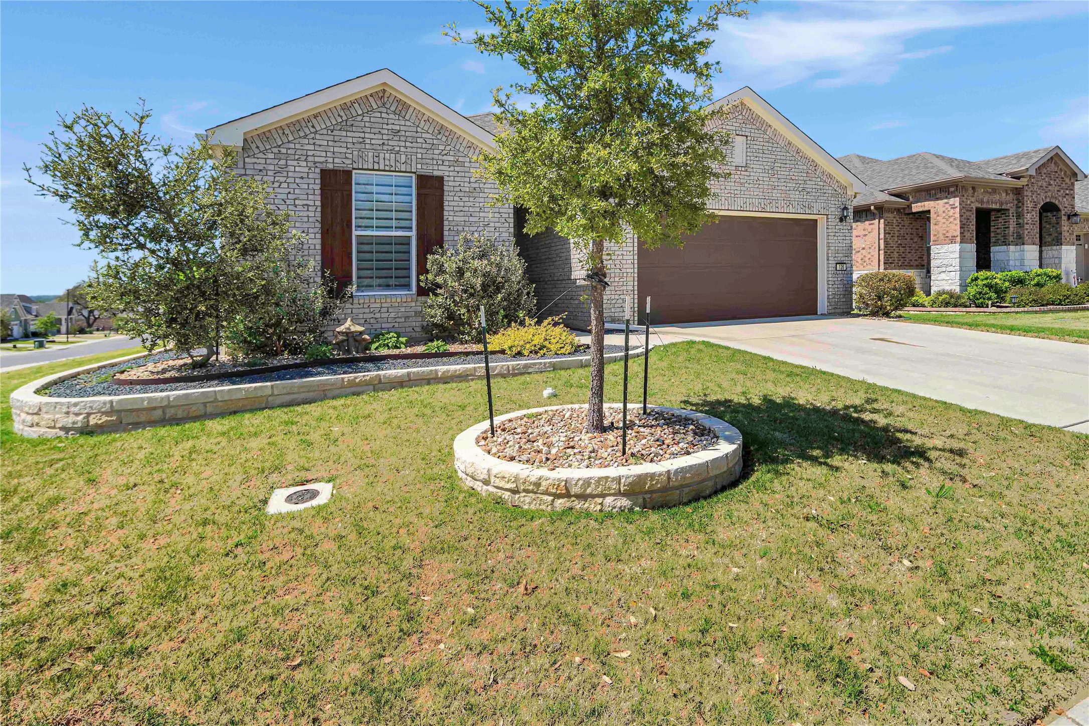 126 Lafayette Street Georgetown, TX 78633 - Photo 2 of 30 a front view of a house with a yard and garage