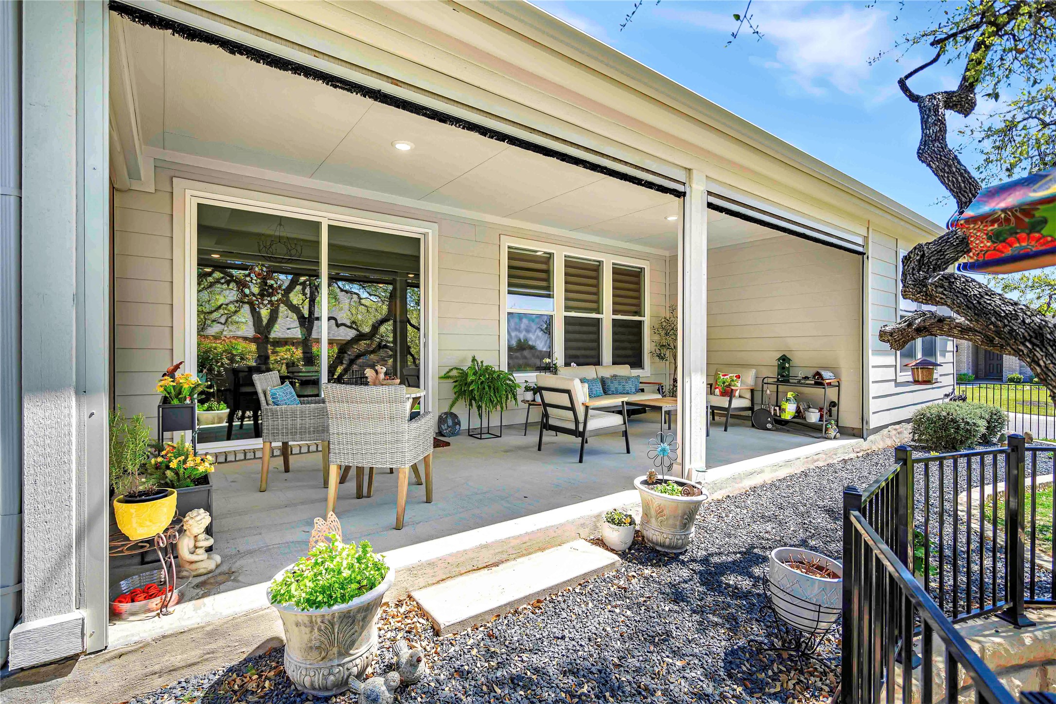 126 Lafayette Street Georgetown, TX 78633 - Photo 30 of 30 a view of a patio with couches table and chairs and potted plants