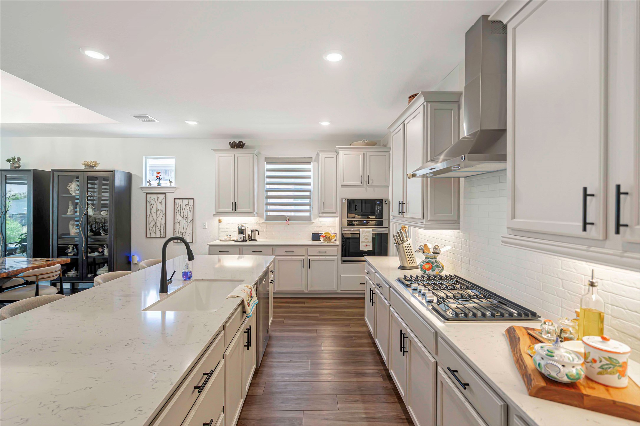 126 Lafayette Street Georgetown, TX 78633 - Photo 8 of 30 a large kitchen with stainless steel appliances granite countertop a lot of counter space and a sink