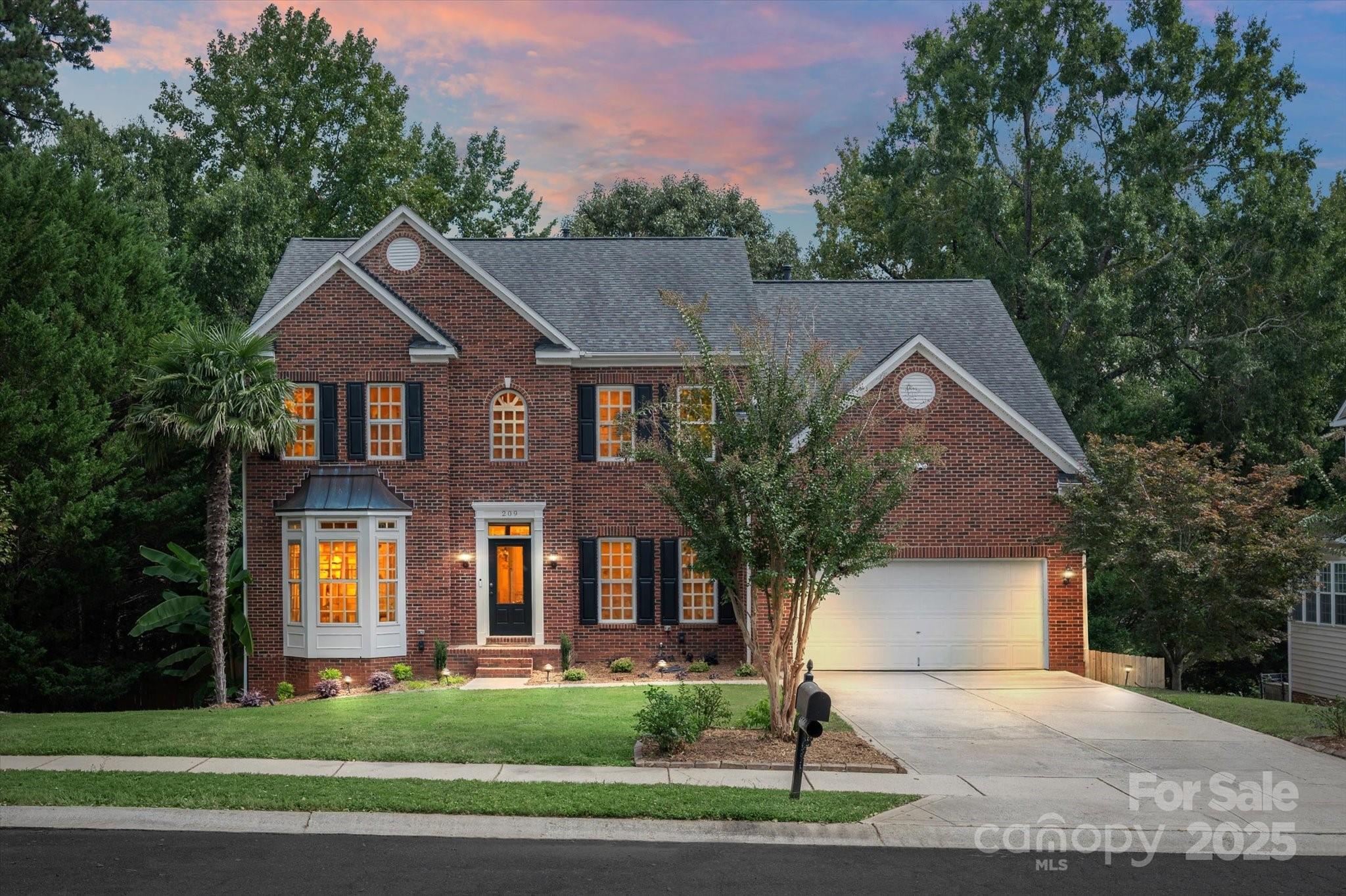 209 Whitegrove Drive Fort Mill, SC 29715 - Photo 1 of 48 a front view of a house with a yard and garage