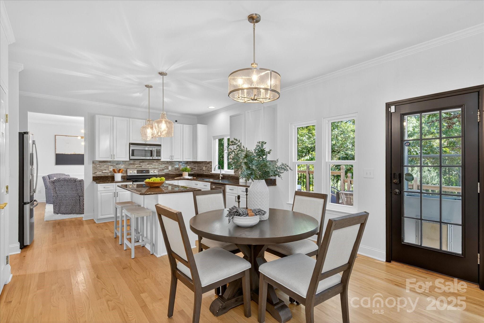209 Whitegrove Drive Fort Mill, SC 29715 - Photo 14 of 48 a view of a dining room with furniture window and wooden floor