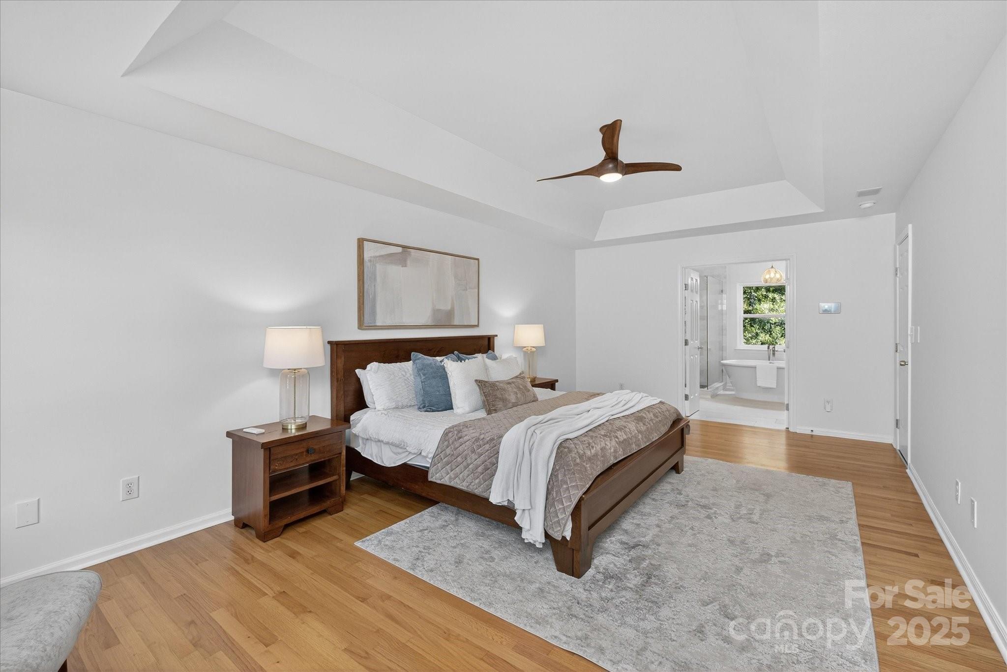 209 Whitegrove Drive Fort Mill, SC 29715 - Photo 24 of 48 a bedroom with a bed and ceiling fan