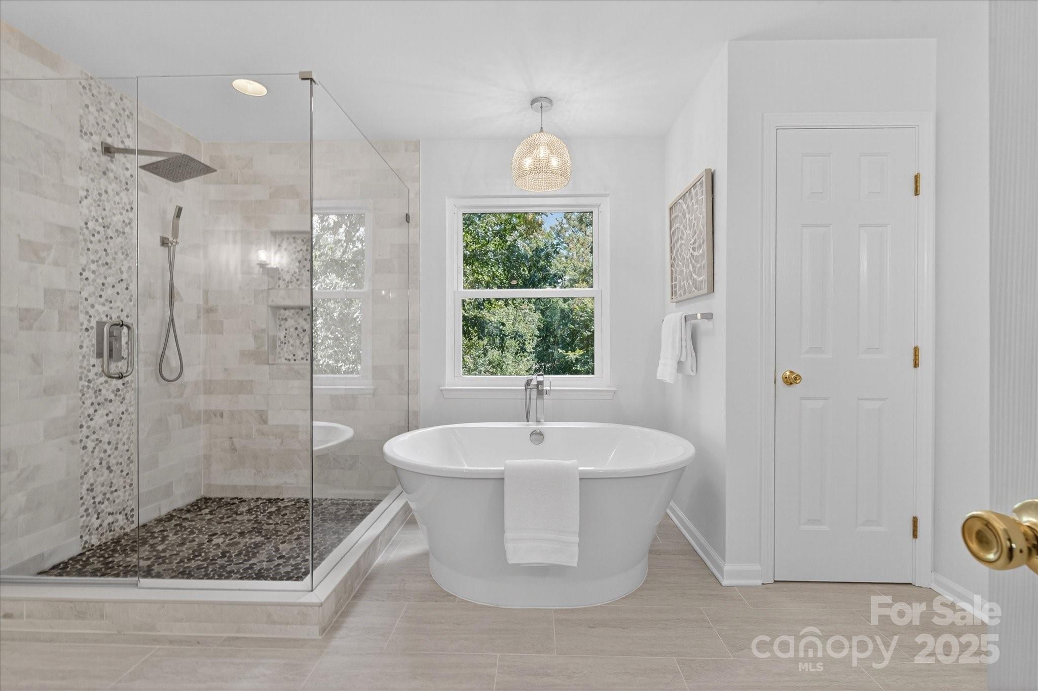 209 Whitegrove Drive Fort Mill, SC 29715 - Photo 25 of 48 a bathroom with a sink a toilet a window and shower