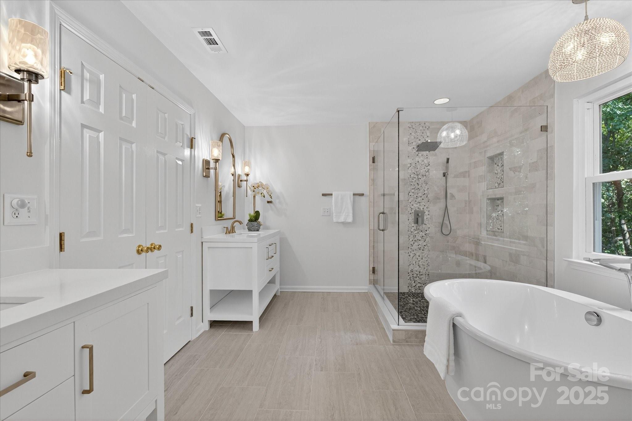 209 Whitegrove Drive Fort Mill, SC 29715 - Photo 26 of 48 a bathroom with a tub a sink and mirror