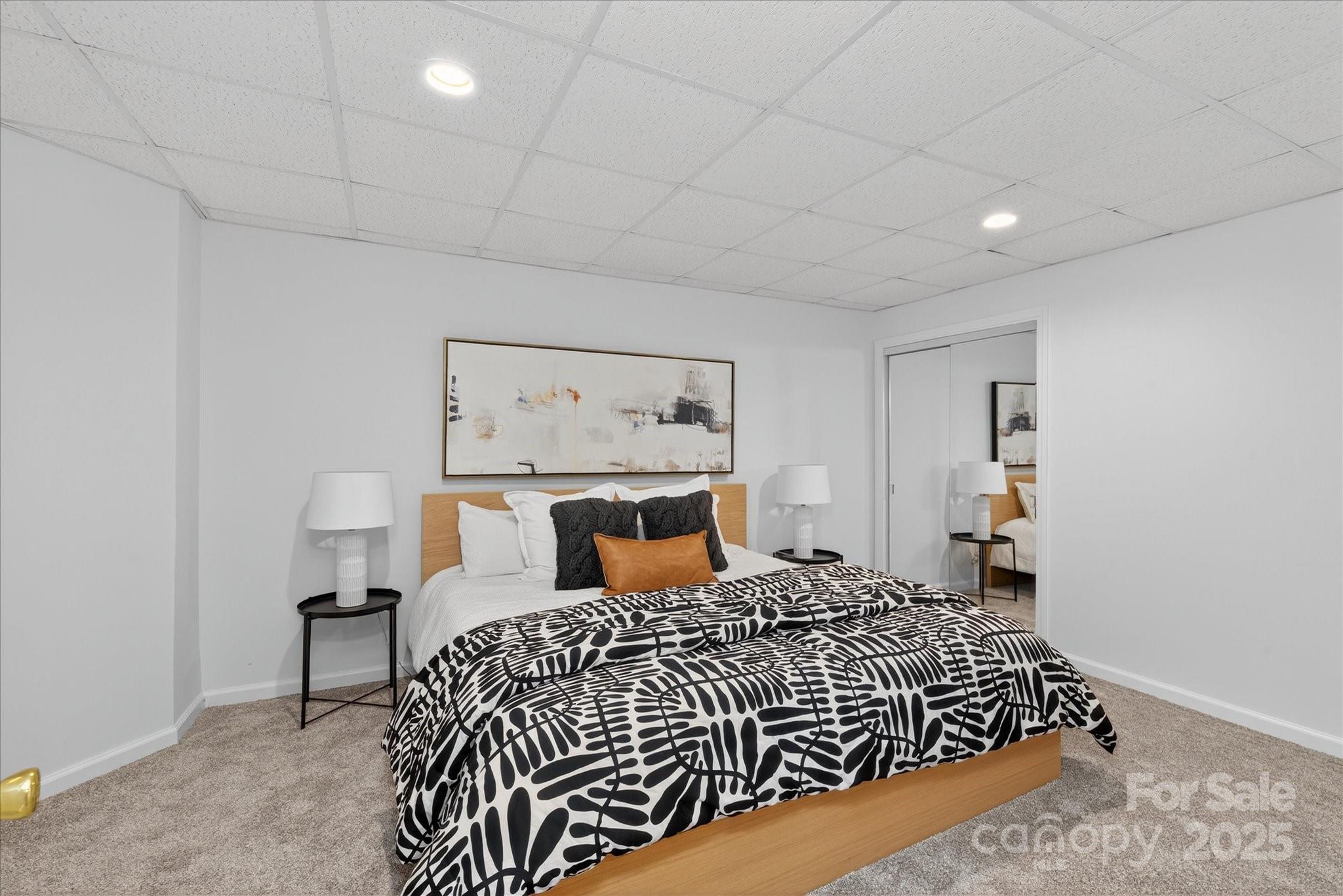 209 Whitegrove Drive Fort Mill, SC 29715 - Photo 33 of 48 a bedroom with a large bed and a lamp on table