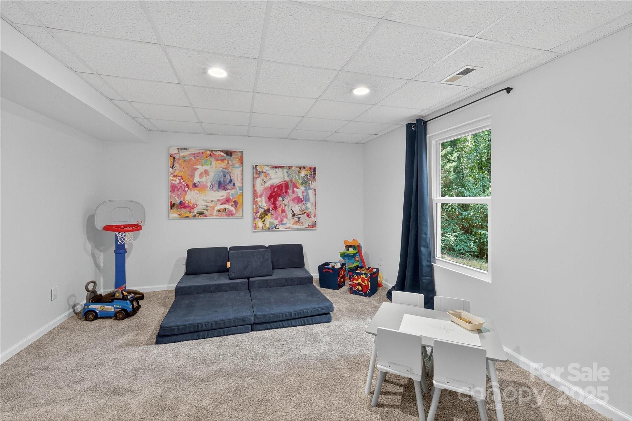 209 Whitegrove Drive Fort Mill, SC 29715 - Photo 36 of 48 a living room with furniture a couch and a window