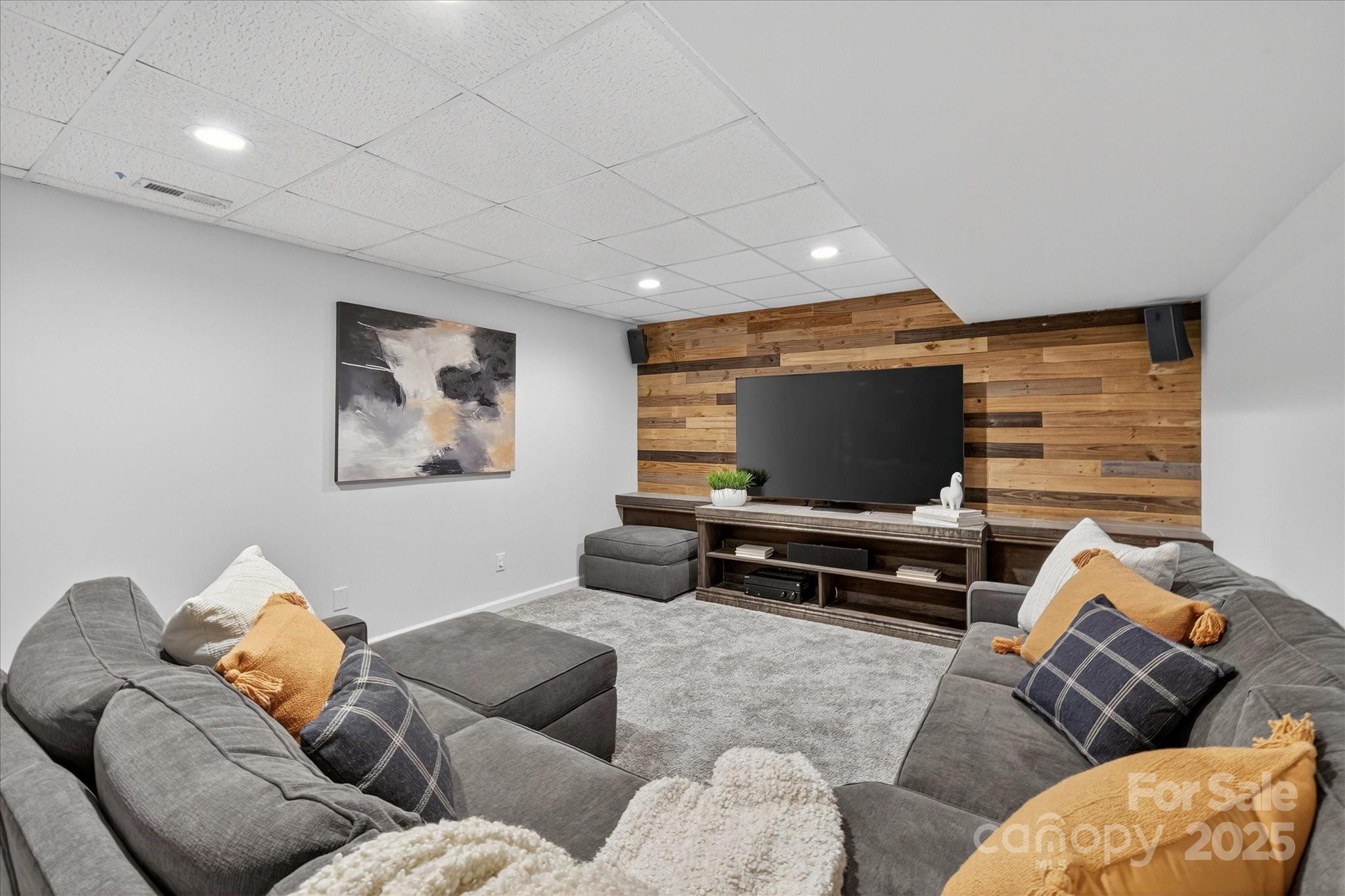 209 Whitegrove Drive Fort Mill, SC 29715 - Photo 39 of 48 a living room with furniture and a flat screen tv