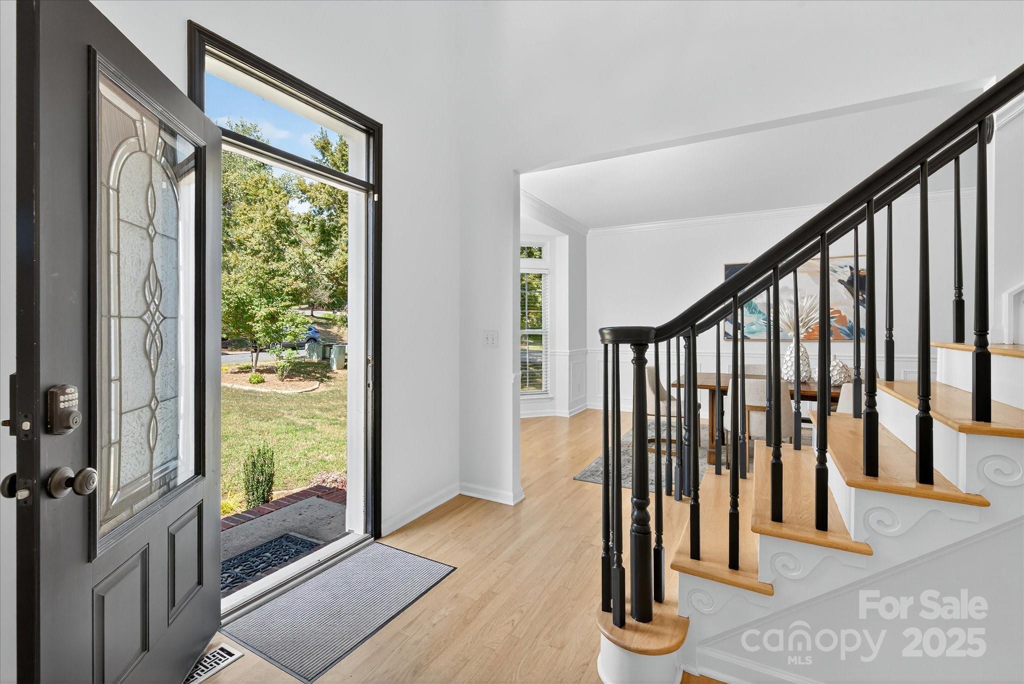 209 Whitegrove Drive Fort Mill, SC 29715 - Photo 4 of 48 a view of an entryway with wooden floor and door