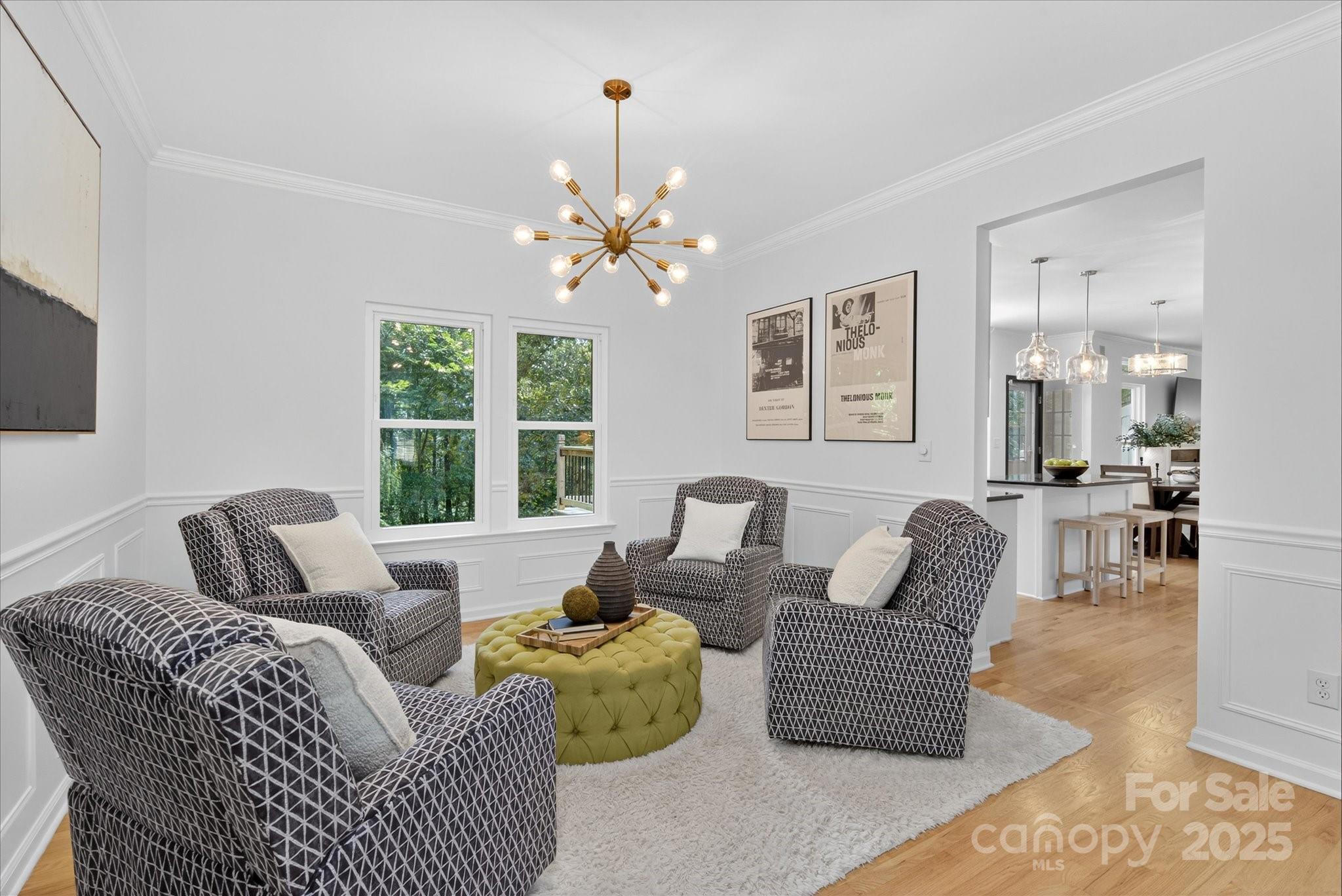 209 Whitegrove Drive Fort Mill, SC 29715 - Photo 8 of 48 a living room with furniture a chandelier and a window