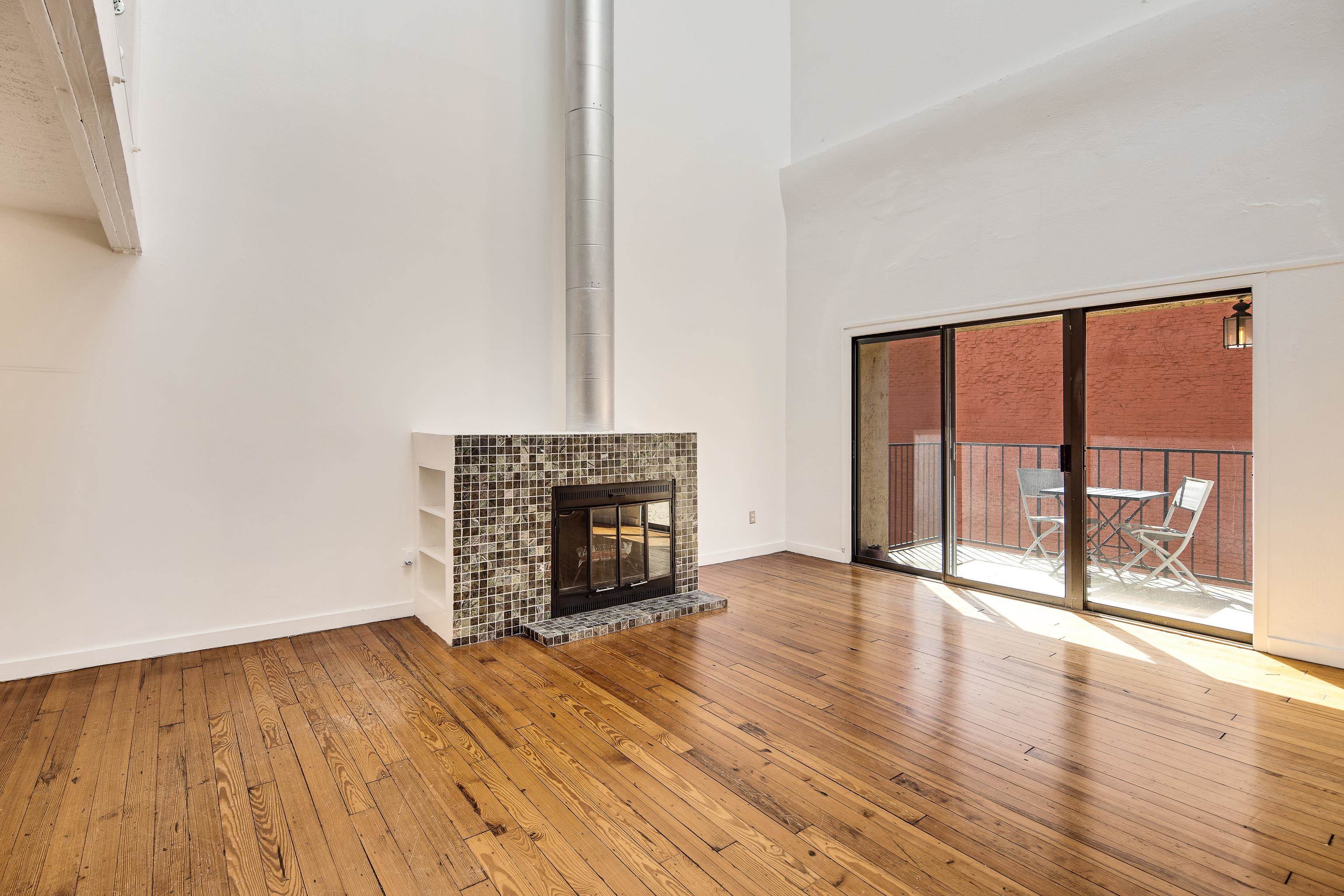 107 South Front Street, Unit 45 Memphis, TN 38103 - Photo 27 of 40 a view of an empty room with wooden floor and a window