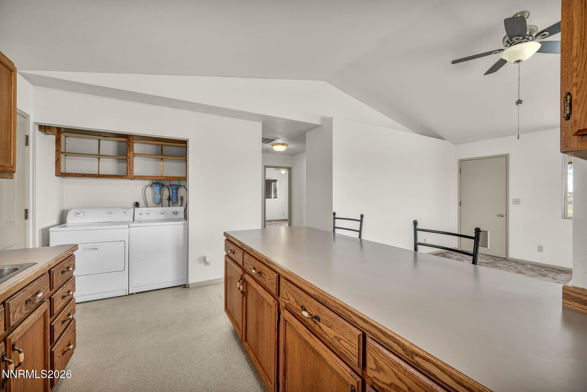 5250 Stillwater Road Fallon, NV 89406 - Photo 13 of 53 a kitchen with sink cabinets and stove