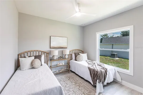 a bedroom with a bed and lamp