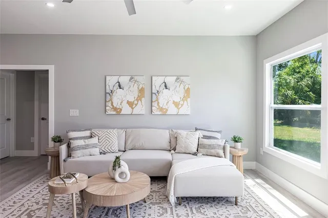 a living room with furniture and a large window