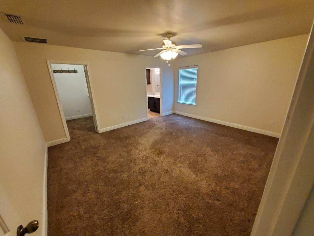 5602 111th Street Lubbock, TX 79424 - Photo 5 of 13 wooden floor in an empty room