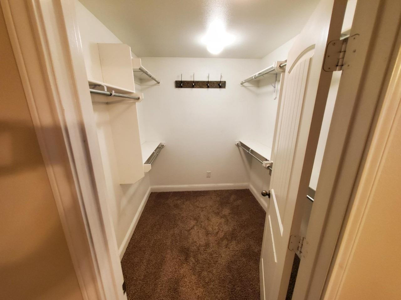 5602 111th Street Lubbock, TX 79424 - Photo 7 of 13 a view of an empty walk in closet