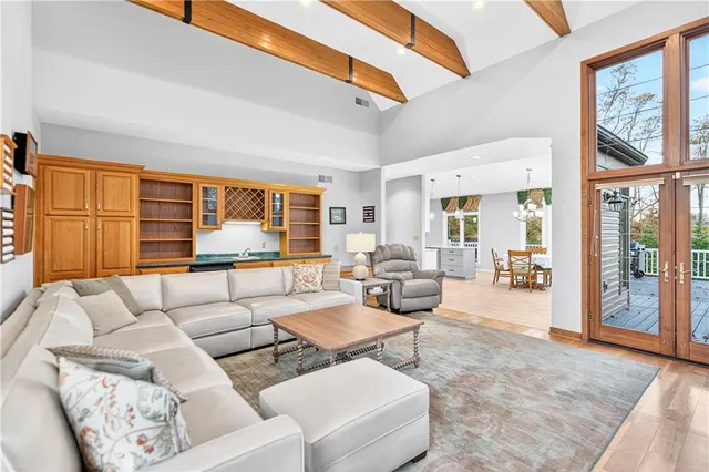 a living room with furniture and large window